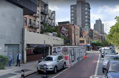 NYC restaurant Cheese Grille uses street dining shed as art gallery