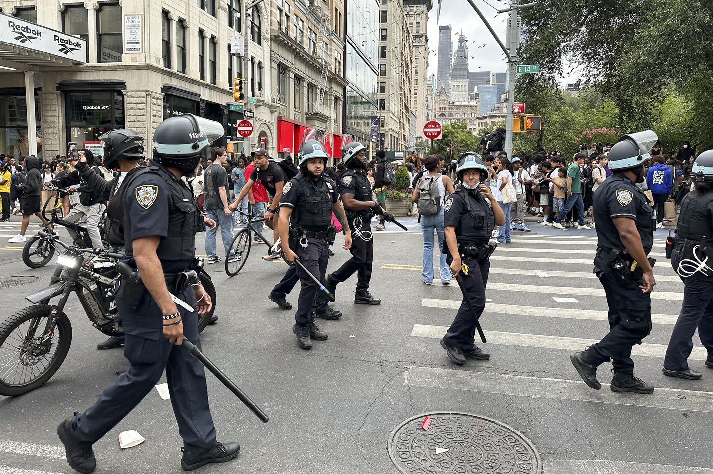 Crowd overwhelms New York City’s Union Square, tosses chairs, climbs on vehicles