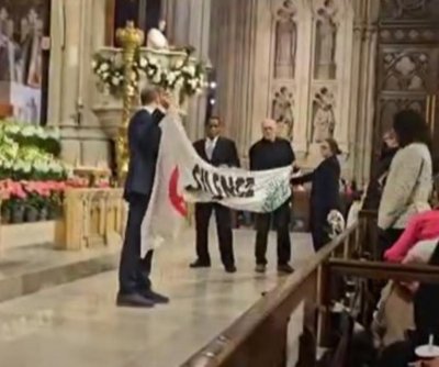 Extinction Rebellion protesters disrupt Easter vigil in NYC