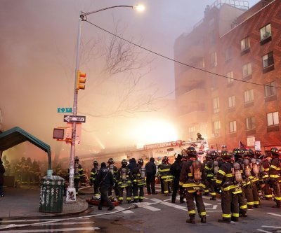 11 firefighters among 14 injured in massive NYC blaze