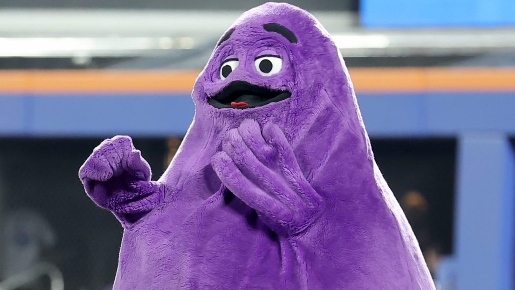 Mets fans were so thrilled to see Grimace while riding the subway to Citi Field