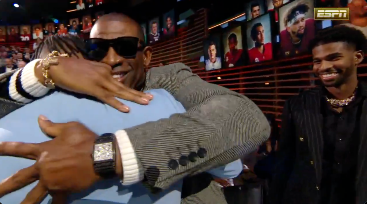 Travis Hunter embraced Deion Sanders after Heisman Trophy win in really sweet moment